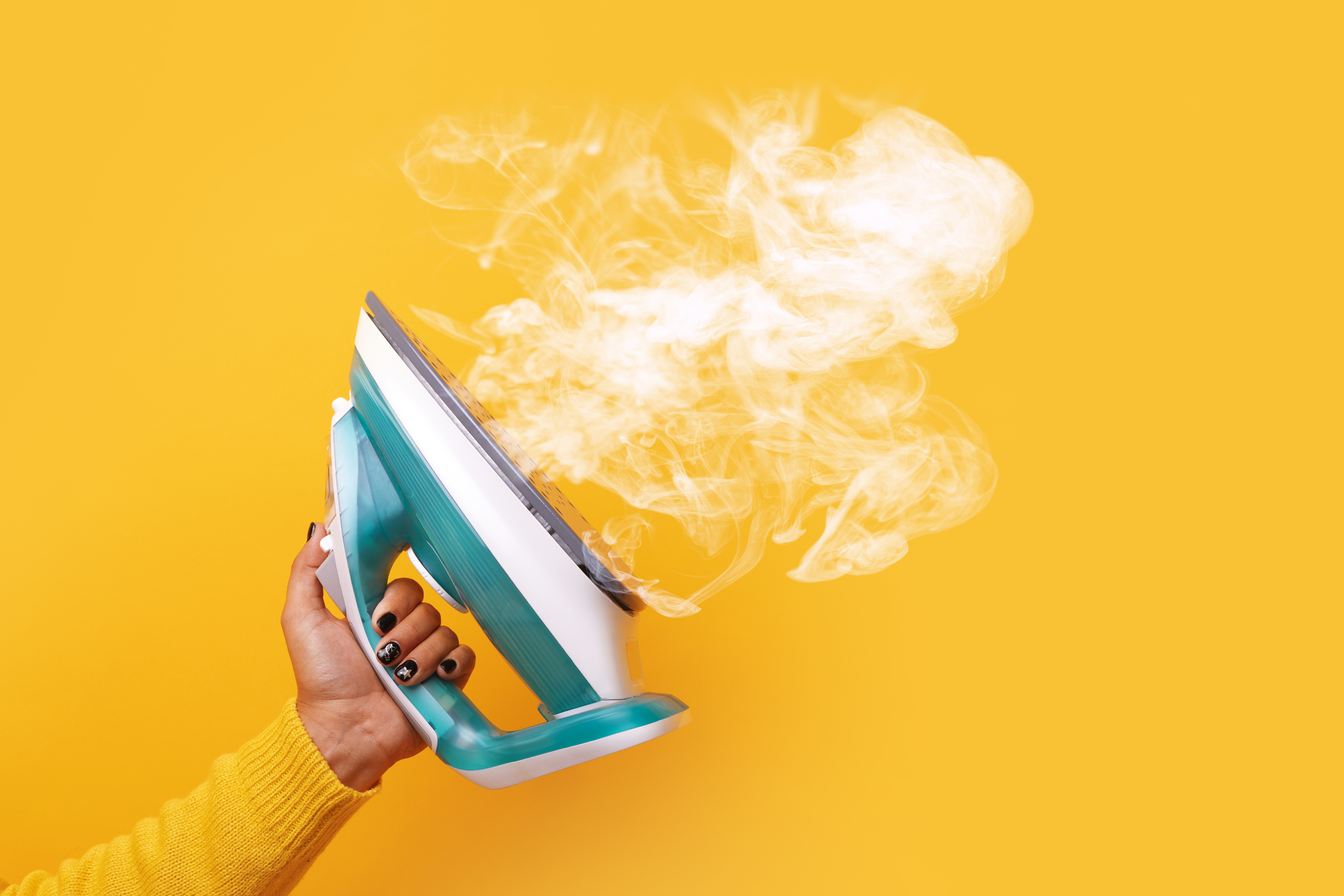vapeur qui sort d'un fer à repasser